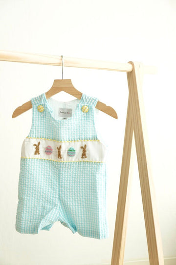 Blue gingham seersucker jonjon with Easter bunny and egg embroidery, perfect for spring.