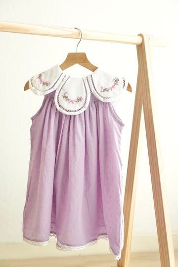 Lavender floral dress with bow embroidery and swiss dot pattern for girls.