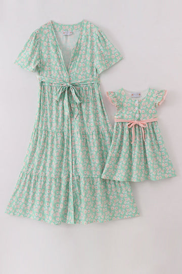 Bright green mom and daughter dresses with vibrant floral print, perfect for spring.