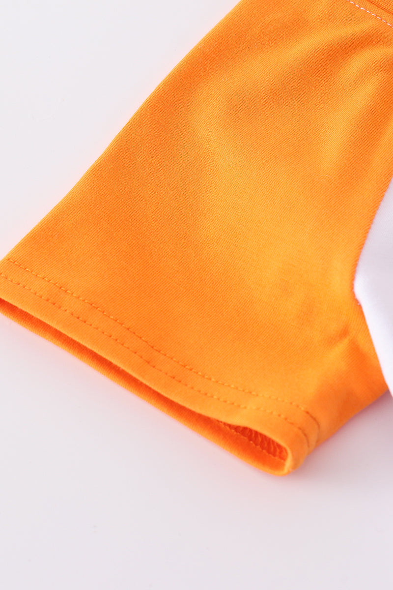 Tennessee football-themed boy's top with vibrant orange and white print.