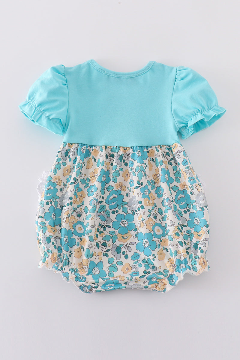 Blue aqua meadow girl bubble romper with floral pattern, perfect for summer play.