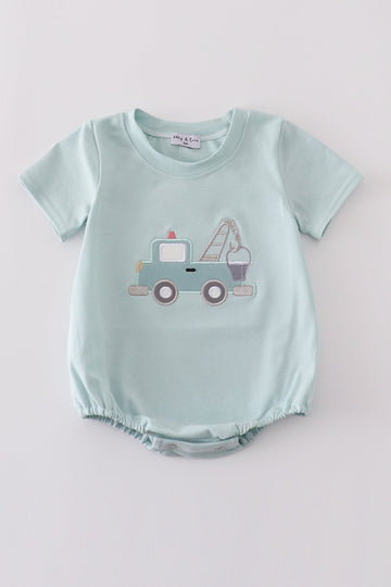 Blue crane truck applique bubble romper with playful truck design on the front.