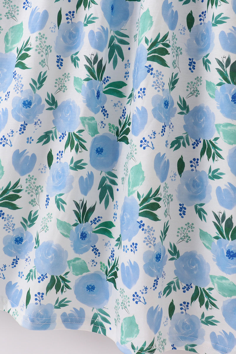 Whimsical floral mom dress with vibrant garden print, perfect for spring outings.