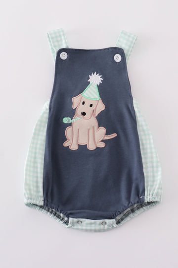 Navy bubble romper with playful puppy birthday applique, perfect for boys.