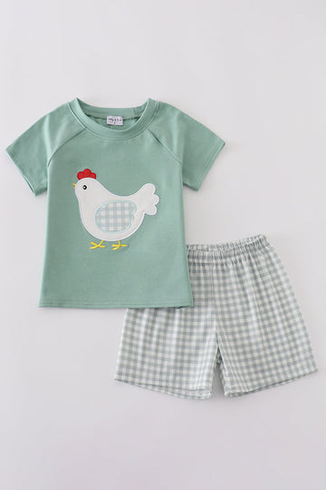 Green boy's outfit with playful chicken applique, perfect for casual playtime.