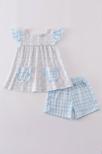 Plaid floral bow print girl set featuring vibrant patterns and playful design.