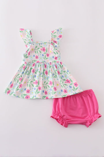 Adorable girl's bloomer set with vibrant meadow print, perfect for sunny days.