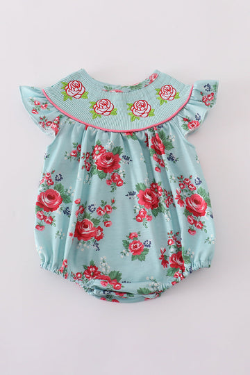 Smocked girl bubble with charming rosebud print, perfect for playful summer days.