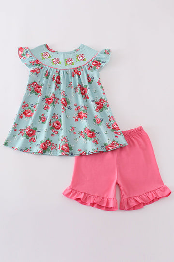 Smocked girl set with a charming rosebud print, perfect for spring outings.