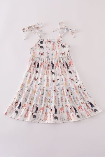 A cute pink dress with playful puppy prints, perfect for parties.