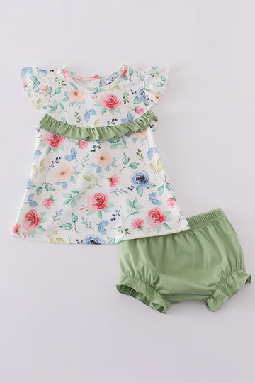 A charming green bloomer set with delicate pink rose patterns, perfect for playtime.