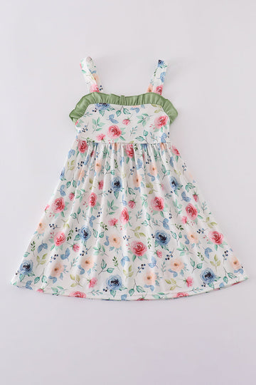 Green garden rose dress with vibrant floral pattern, perfect for playful summer days.