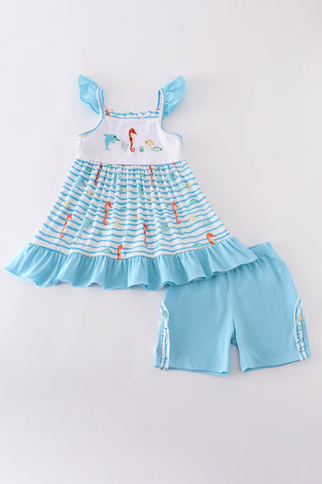 Children’s blue outfit with embroidered sea creatures, perfect for playtime adventures.