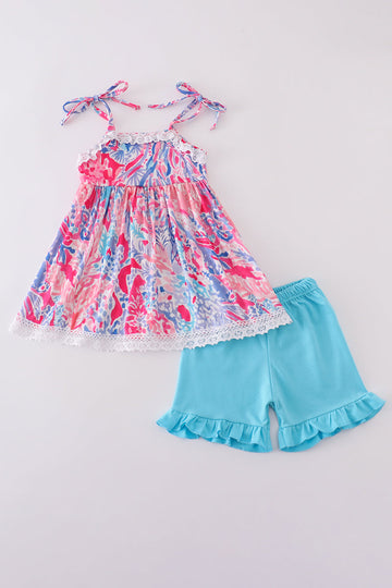 Tropical Sunset Waves set: vibrant beach-themed shirt and shorts with colorful wave patterns.