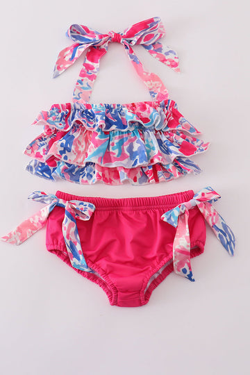 Bright pink two-piece swimsuit with reef print, perfect for beach adventures.