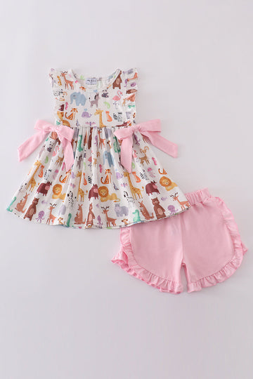 Adorable pink ruffle set with playful zoo animal print and bow accents.