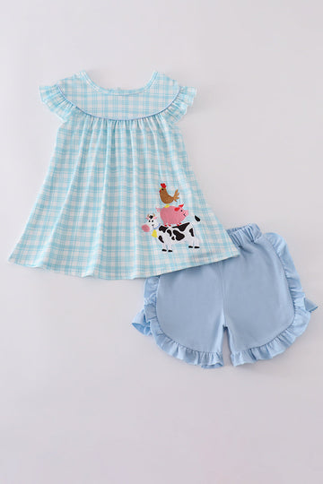 Blue farm-themed ruffle shorts set with playful appliques for kids.