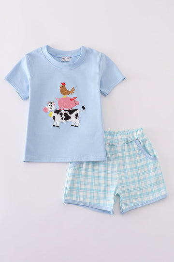 Blue farm-themed shorts set with playful applique designs, perfect for summer fun.