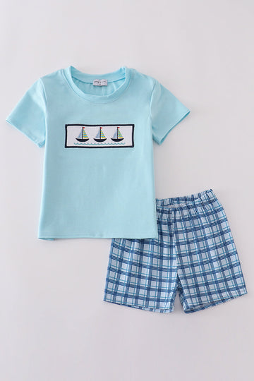 Toddler shorts set with blue sailboats embroidery and smocked detailing, perfect for summer.