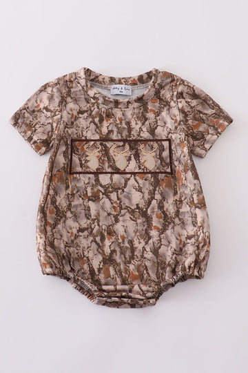 Brown bubble romper with three adorable deer embroidered on the front.