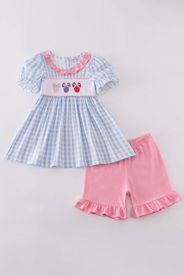 Blue gingham ruffle shorts set with playful character embroidery, perfect for summer fun.