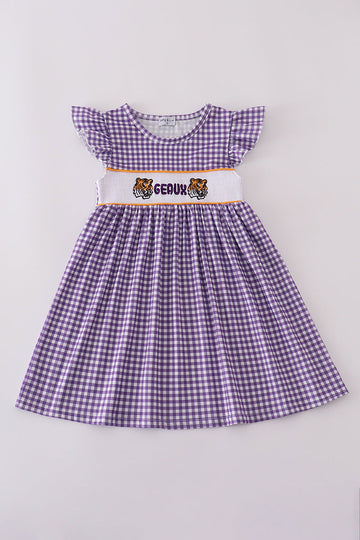 Purple smocked dress with gold LSU geaux embroidery, perfect for game day.