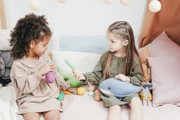 Kids sharing their toys with one another