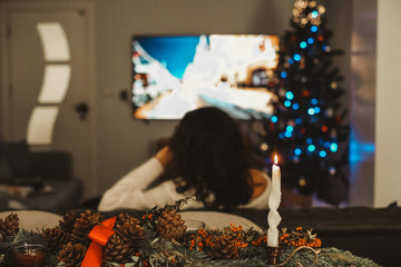 Lady watching Tv On christmas