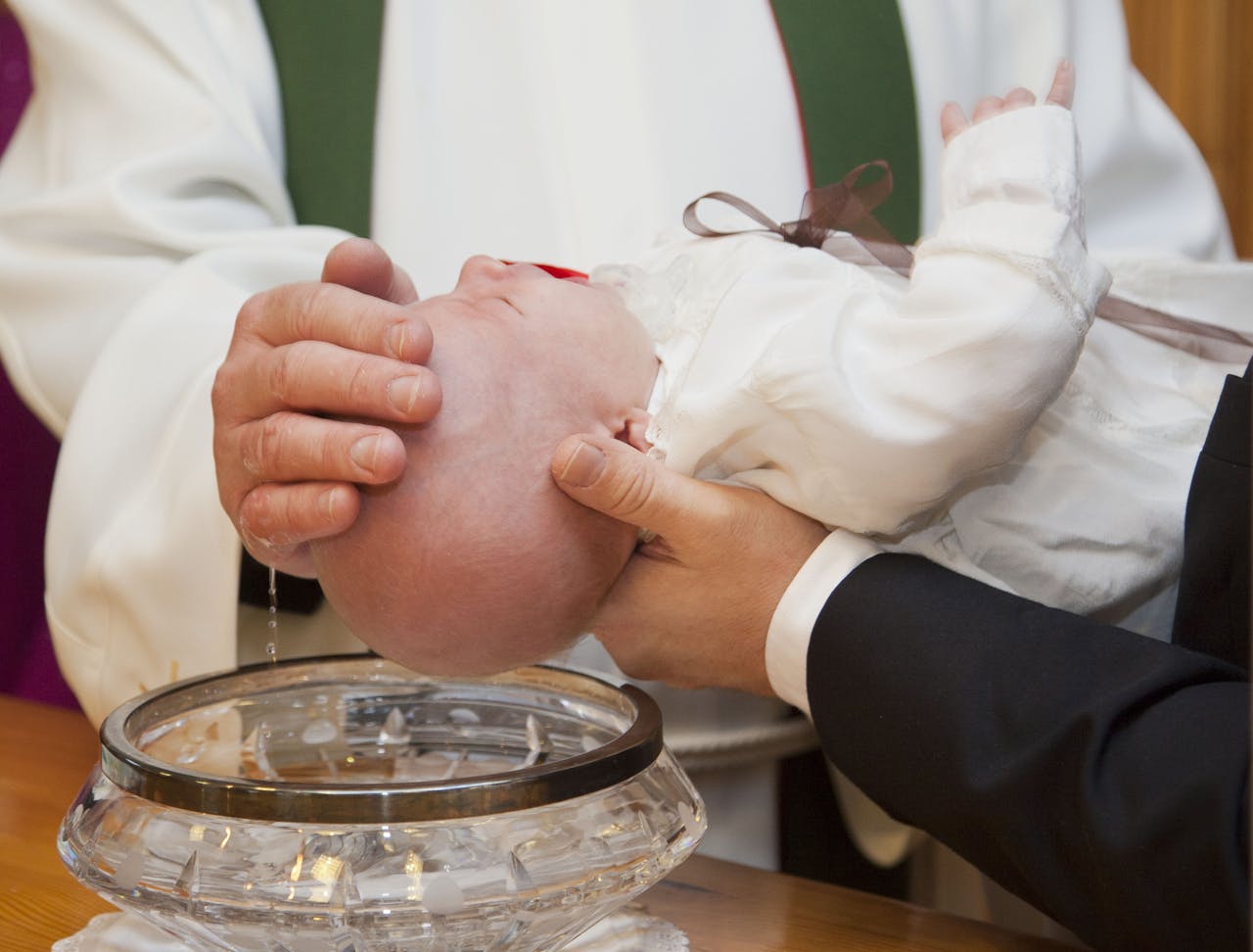 Toddler being baptized 