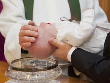Toddler being baptized 