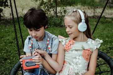 Two kids listening to music
