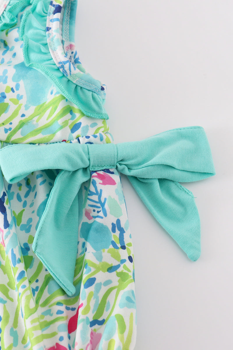 Tropical breeze print bubble romper with vibrant palm leaves, perfect for summer fun.