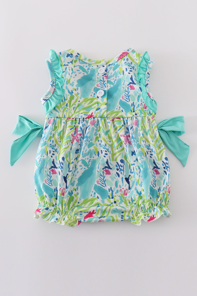 Tropical breeze print bubble romper with vibrant palm leaves, perfect for summer fun.