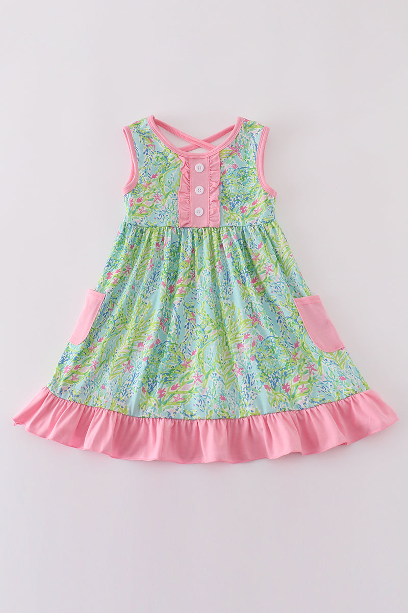 A charming ruffle dress with a colorful meadow breeze print for girls.