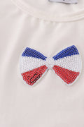 Children's top with flag bow, ice-cream, and sequin details, perfect for matching outfits.