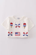 Children's top with flag bow, ice-cream, and sequin details, perfect for matching outfits.