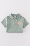 Sage green boy's shirt with delicate sand dollar embroidery, perfect for beach outings.
