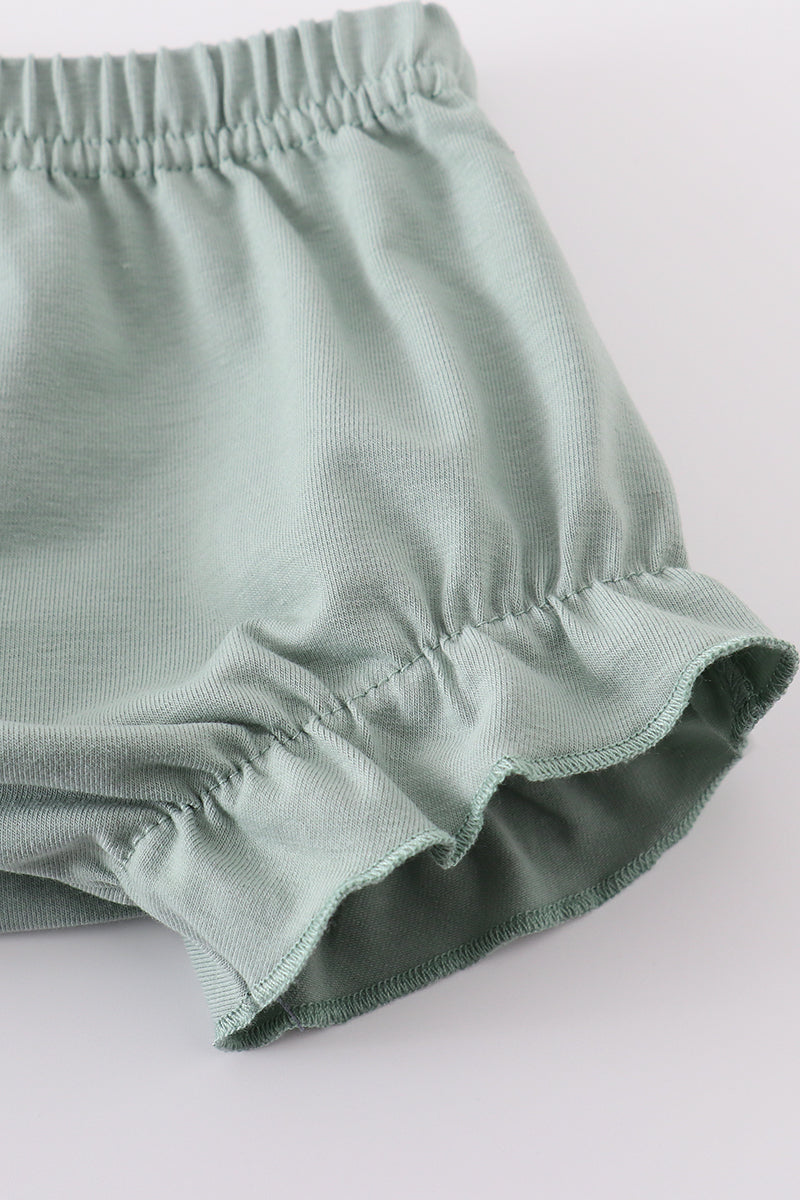 Sage green smocked bloomer set with sand dollar embroidery, perfect for summer.