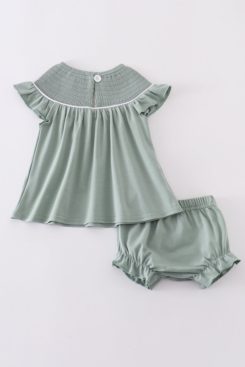 Sage green smocked bloomer set with sand dollar embroidery, perfect for summer.