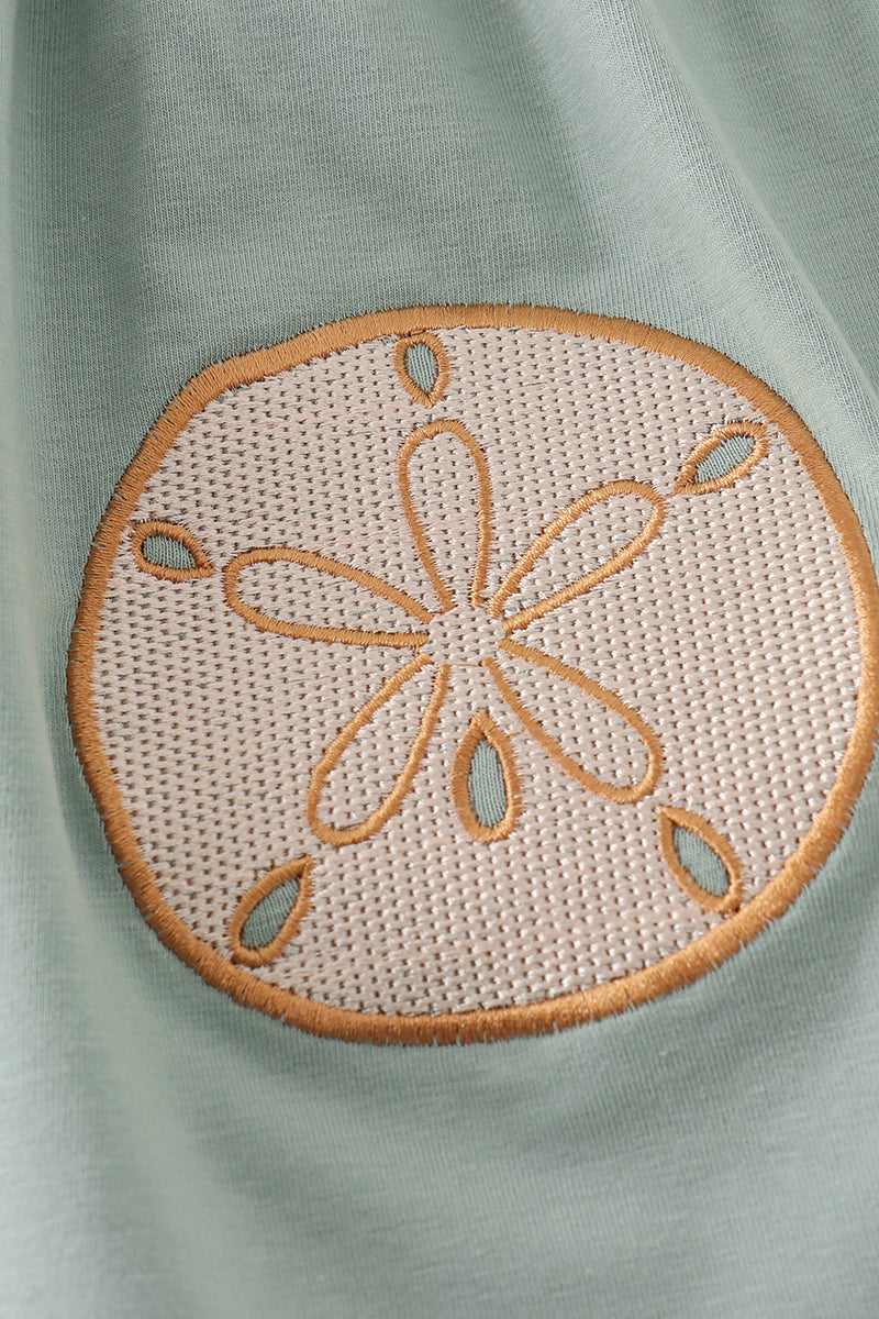 Sage green girl's set with sand dollar embroidery, perfect for beach outings.