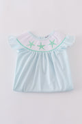 A charming blue stripe dress with starfish embroidery and smocked detailing, perfect for summer.