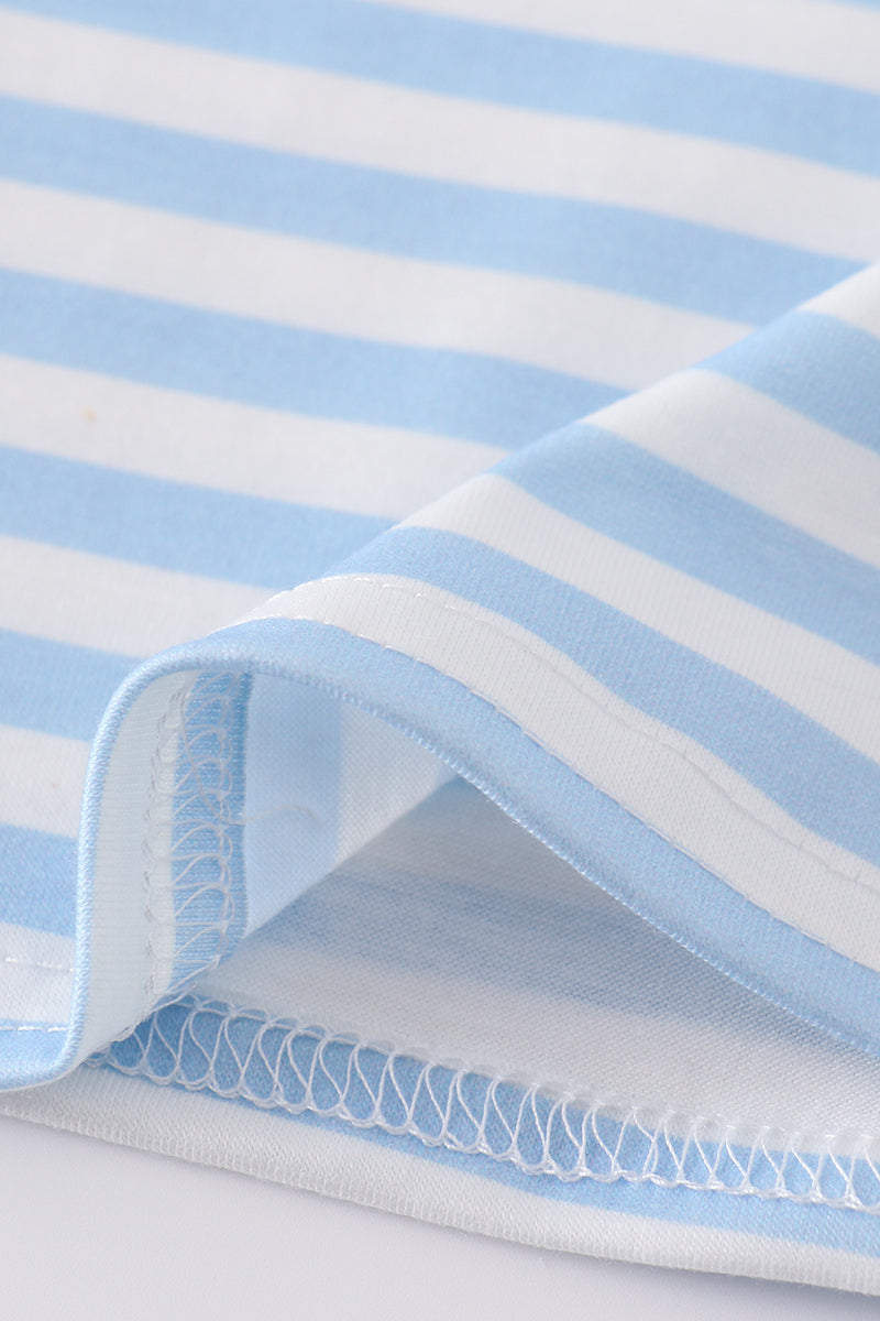 A charming boy's outfit with blue stripes and helicopter embroidery, perfect for playtime.