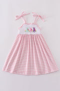 Pink gingham dress with adorable bunny embroidery, perfect for springtime fun.