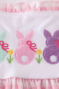 Pink gingham dress with adorable bunny embroidery, perfect for springtime fun.