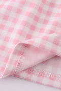 Pink gingham dress with adorable bunny embroidery, perfect for springtime fun.