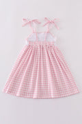 Pink gingham dress with adorable bunny embroidery, perfect for springtime fun.
