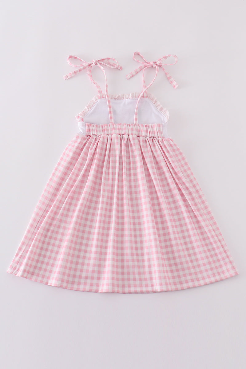 Pink gingham dress with adorable bunny embroidery, perfect for springtime fun.