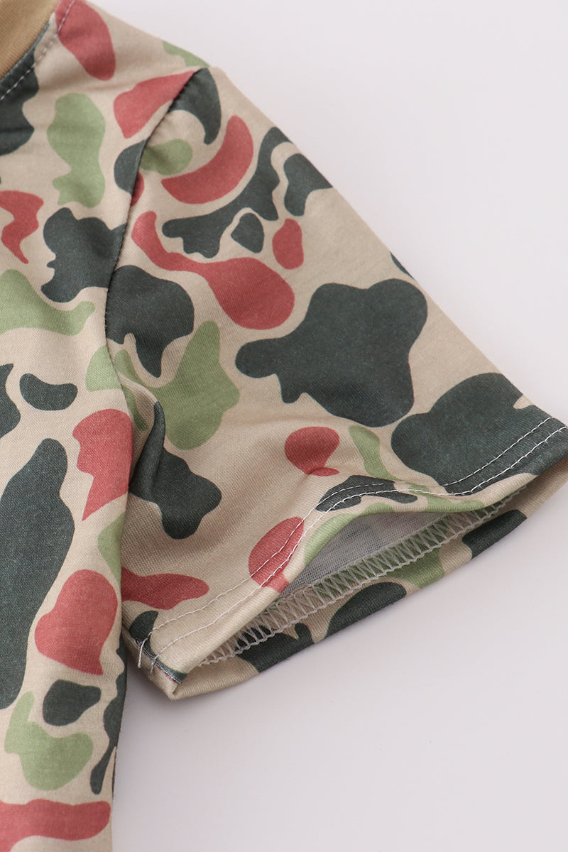 Cozy camouflage top with playful cross embroidery, perfect for adventurous kids.