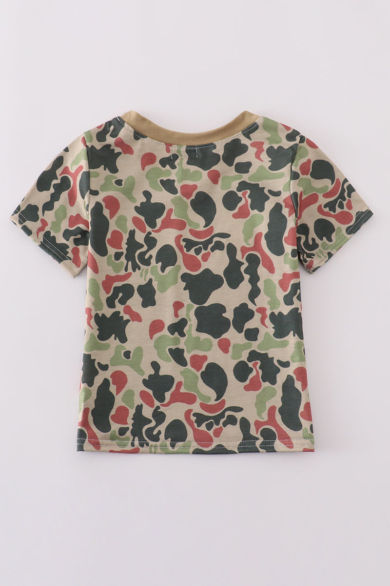 Cozy camouflage top with playful cross embroidery, perfect for adventurous kids.