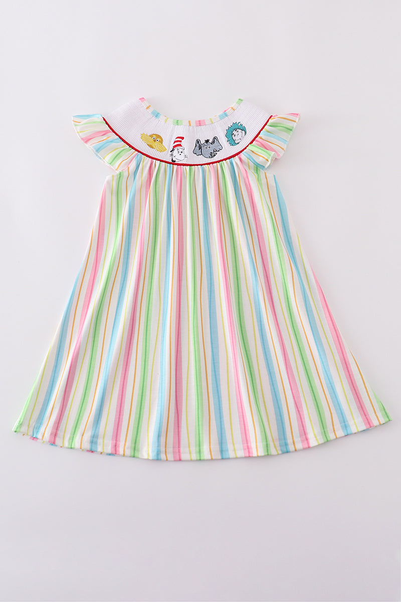 Whimsical striped smocked dress with Dr. Seuss embroidery, perfect for playful adventures.